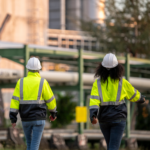 Image of two subcontractors walking on to site after completing their daily pre starts