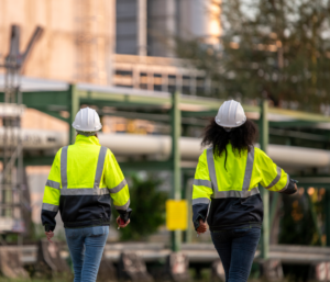 Image of two subcontractors walking on to site after completing their daily pre starts