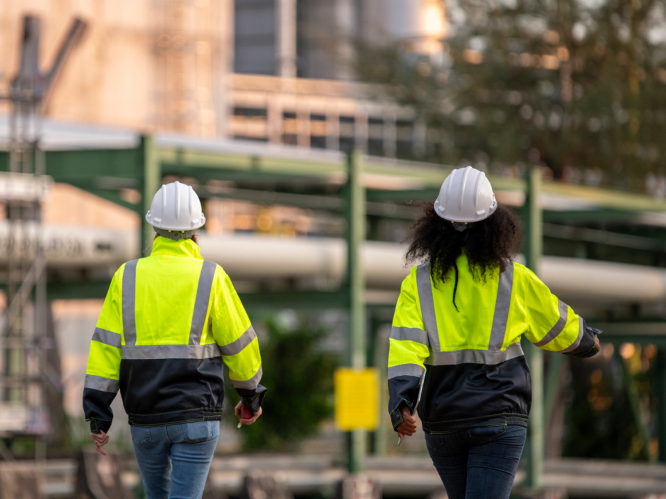 Image of two subcontractors walking on to site after completing their daily pre starts