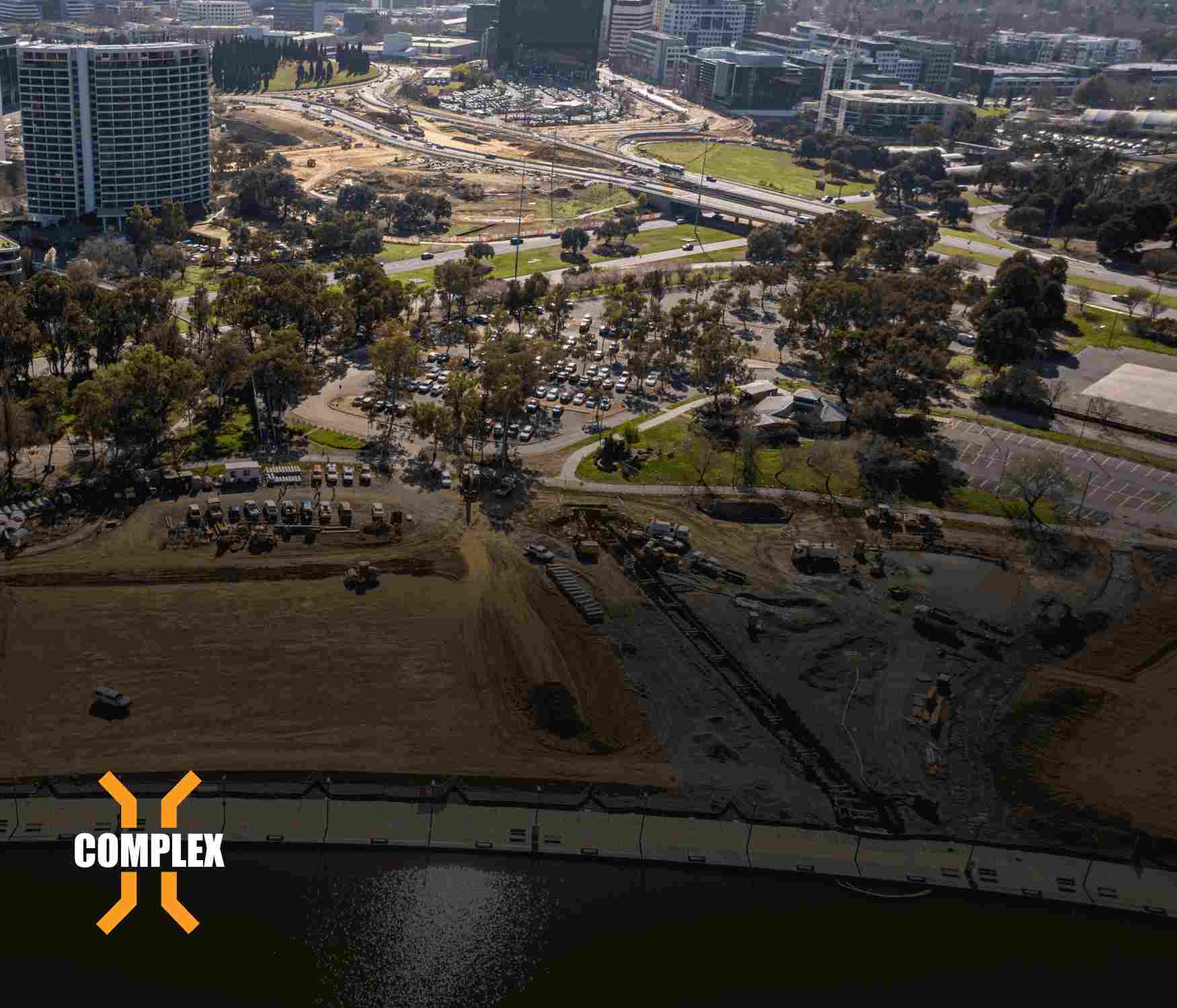 Complex Co. construction site overlayed with logo and gradient